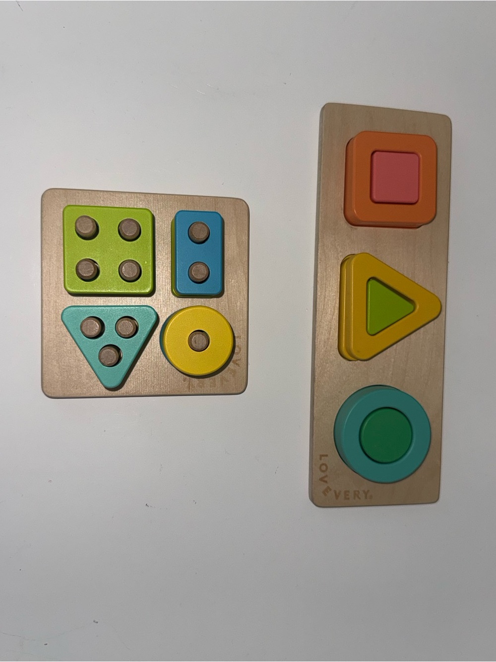 Lovevery Wooden Shape & Stack Toy Set in Green, Yellow, Blue, Orange, Pink